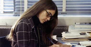 This undated handout photograph released by the Smithsonian National Air and Space Museum on July 11, 2019, shows Margaret Hamilton, a member of the Draper Laboratory staff, at work during the Apollo missions. (AFP Photo)