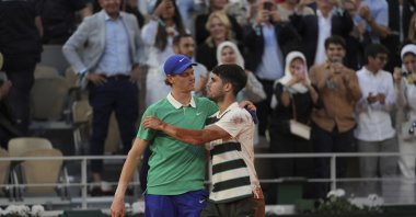 Spain's Carlos Alcaraz (R) and Italy's Jannik Sinner hug after the final match of the French Open at the Roland-Garros Stadium, Paris, France, June 8, 2025. (AP Photo)
