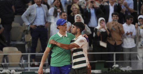 Spain's Carlos Alcaraz (R) and Italy's Jannik Sinner hug after the final match of the French Open at the Roland-Garros Stadium, Paris, France, June 8, 2025. (AP Photo)