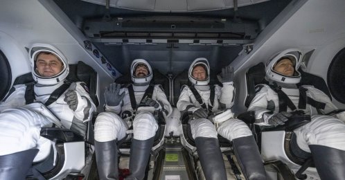 A handout picture made available by the National Aeronautics and Space Administration (NASA) shows Roscosmos cosmonaut Andrey Fedyaev, left, NASA astronauts Jack Hathaway and Jessica Meir, and ESA (European Space Agency) astronaut Sophie Adenot are seen inside the SpaceX Dragon Freedom spacecraft onboard the SpaceX recovery ship SHANNON shortly after having landed in the Pacific Ocean off the coast of Los Angeles, California, Oct. 8, 2026. (NASA Handout via EPA)