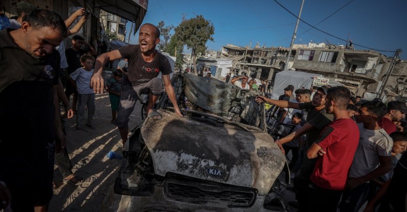 Locals inspect the site of an Israeli attack in Tel al-Hava neighborhood, Gaza Strip, Palestine, Oct. 8, 2026. (AA Photo)