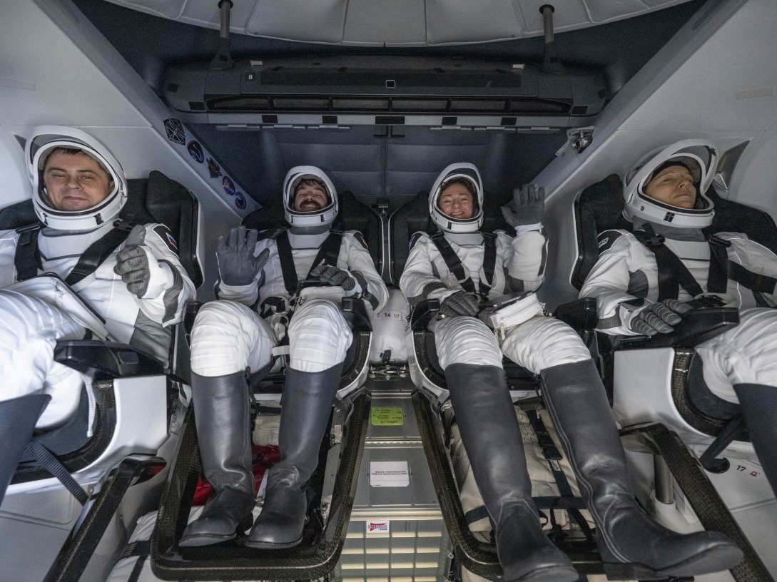 A handout picture made available by the National Aeronautics and Space Administration (NASA) shows Roscosmos cosmonaut Andrey Fedyaev, left, NASA astronauts Jack Hathaway and Jessica Meir, and ESA (European Space Agency) astronaut Sophie Adenot are seen inside the SpaceX Dragon Freedom spacecraft onboard the SpaceX recovery ship SHANNON shortly after having landed in the Pacific Ocean off the coast of Los Angeles, California, Oct. 8, 2026. (NASA Handout via EPA)
