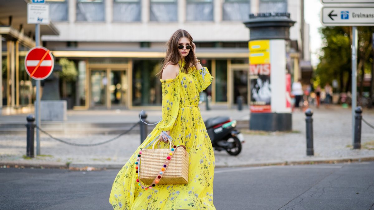 Maxilie Mlinarskij wearing a yellow maxi dress, Berlin, Germany, Aug. 5, 2018. (Getty Images Photo)