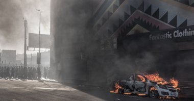 A car is set alight after clashes erupted between protesters and foreign nationals, Durban, South Africa, Oct. 8, 2026. (AFP Photo)