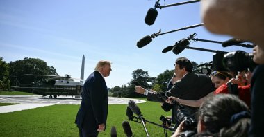 U.S. President Donald Trump talks to members of the press before boarding Marine One from the South Lawn of the White House in Washington, D.C., Oct. 1, 2026. (AFP File Photo)