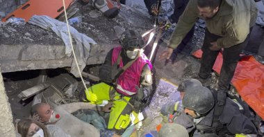 Ukrainian rescuers search for and free people trapped under the rubble at the site of a Russian attack on a residential area in Zaporizhzhia, Ukraine, Oct. 10, 2026. (EPA Photo)