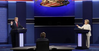 Democratic presidential nominee Hillary Clinton (R) exchanges views with Republican presidential nominee Donald Trump during the third presidential debate at UNLV, Las Vegas, U.S., Oct. 19, 2016. (AP Photo)