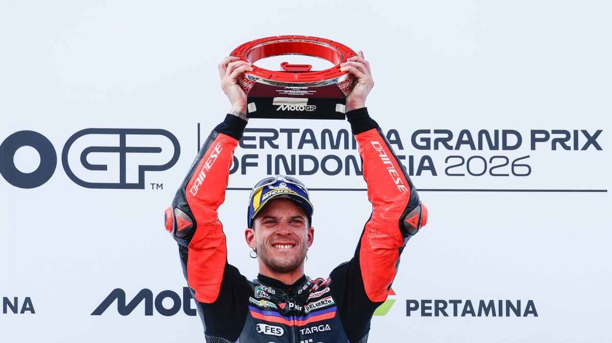 Aprilia Racing's rider Marco Bezzecchi celebrates on the podium after winning the Indonesia MotoGP in Mandalika, Indonesia, Oct. 11, 2026. (EPA Photo)