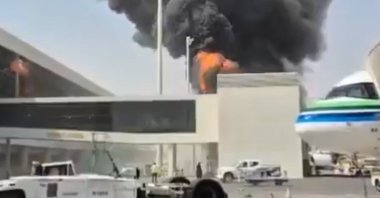 This image from video obtained and verified by AP shows thick black smoke and flames rising from a fire at King Khalid International Airport in Riyadh, Saudi Arabia, Friday, Oct. 9, 2026. (AP Photo)
