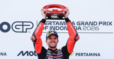 Aprilia Racing's rider Marco Bezzecchi celebrates on the podium after winning the Indonesia MotoGP in Mandalika, Indonesia, Oct. 11, 2026. (EPA Photo)