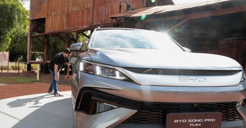 A person looks at a BYD Song Pro Flex vehicle during the launch of the Chinese automaker's first Brazilian-made plug-in hybrid flex-fuel car at the Museu da Cana in Sertaozinho, Sao Paulo state, Brazil, Aug. 4, 2026. (Reuters Photo)
