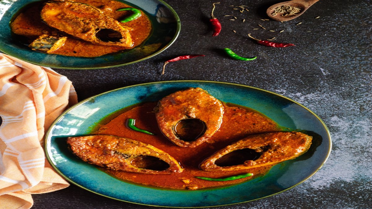 Hilsa fish Curry in a Red Cumin-paste Gravy in traditional Bengali style.