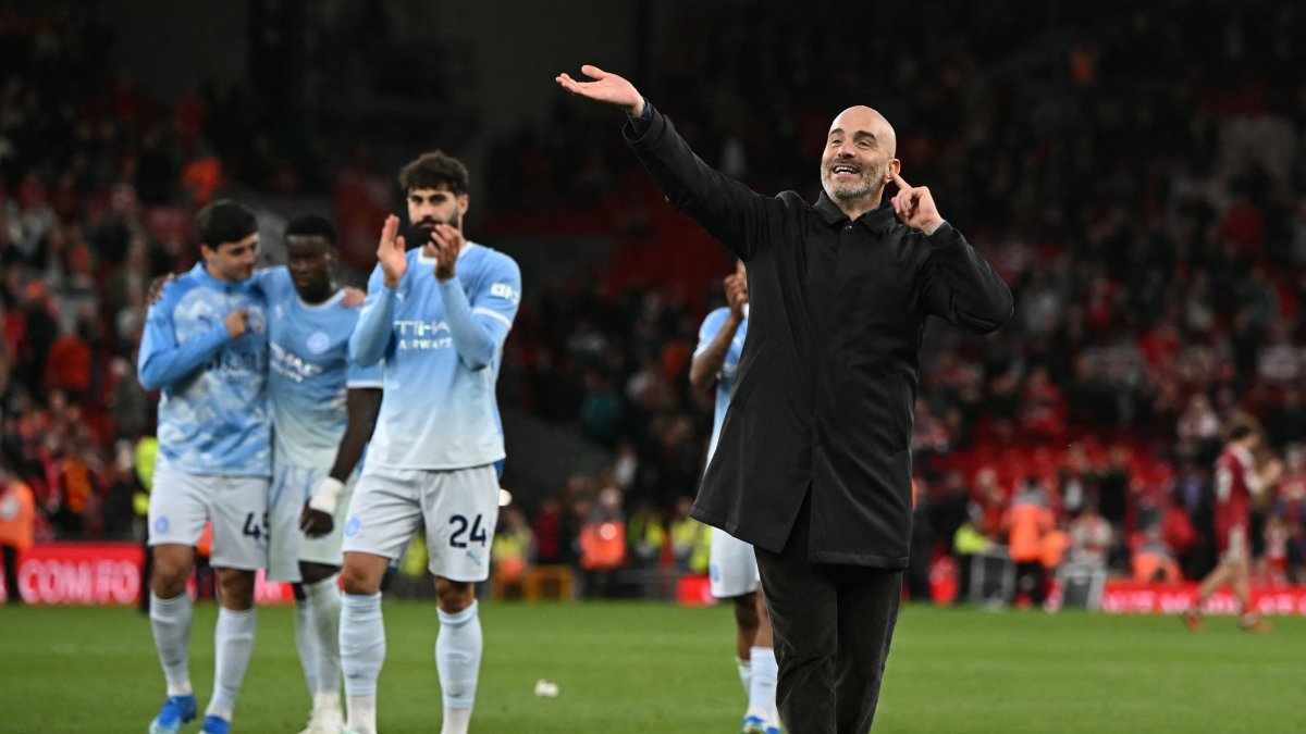 Manchester City's manager Enzo Maresca (R) celebrates on the pitch after a Premier League match against Liverpool at Anfield, in Liverpool, U.K., Oct. 11, 2026. (AFP Photo)