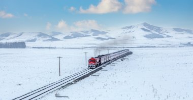 The Eastern Express travels through snow-covered landscapes, Kars, Türkiye, Jan. 10, 2025. (Shutterstcok Photo)