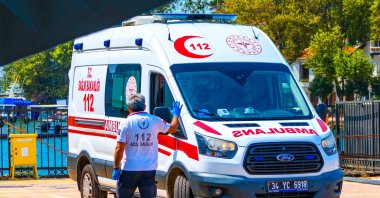 A paramedic stands beside a Ministry of Health ambulance, Istanbul, Türkiye, Aug. 8, 2025. (Shutterstock Photo)