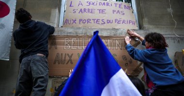 French university students stick posters on a wall at the Ecole des Mines, as part of nationwide protests to demand better school conditions in Paris, France, Oct. 9, 2026. (Reuters Photo)