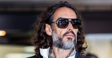 British comedian and actor Russell Brand leaves Southwark Crown Court after pleading not guilty to three charges of rape, indecent assault and three counts of sexual assault, London, U.K., Oct. 12, 2026. (AFP Photo)