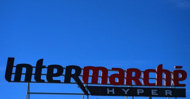 The logo of French supermarket Intermarche, part of the group Les Mousquetaires, is seen on the facade of a store in Agde, France, Oct. 9, 2026. (AFP Photo)