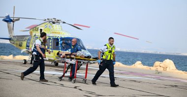 Israeli paramedics transport an injured man after he arrived by helicopter from an incident involving an explosion in northern Israel, near the country's border with Lebanon, Haifa, Israel, Oct. 12, 2026. (Reuters Photo)