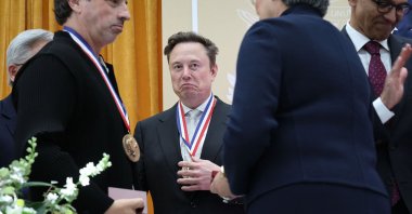 Elon Musk (C) is photographed during a summit in Washington, U.S., Oct. 8, 2026. (AFP Photo)