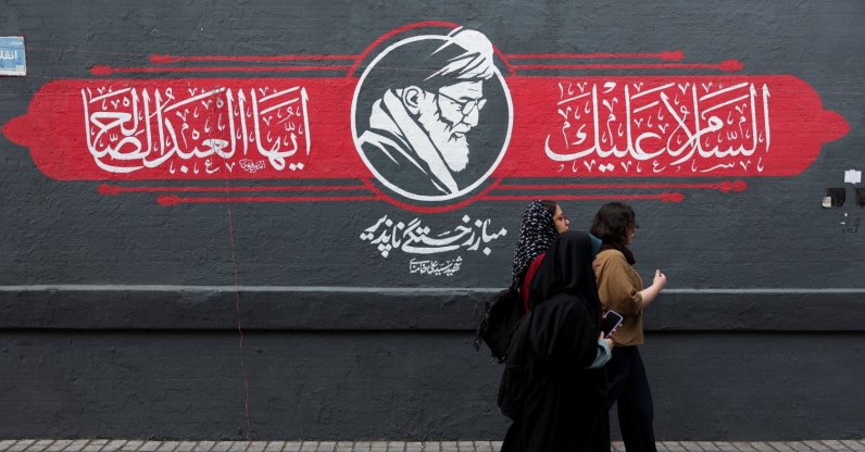 People walks past a mural depicting Iran's late Supreme Leader Ayatollah Ali Khamenei, in Tehran, Iran, Oct. 7, 2026. (Reuters Photo)