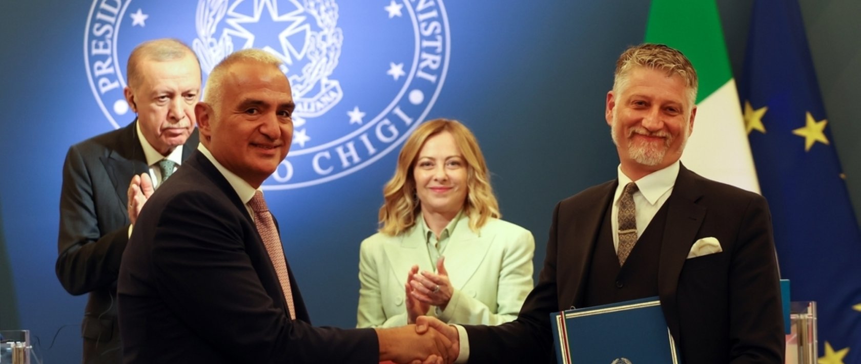 Türkiye’s Culture and Tourism Minister Mehmet Nuri Ersoy (C-L) and Italian Culture Minister Alessandro Giuli (R) shake hands during a news conference following a meeting between President Recep Tayyip Erdoğan and Italian Prime Minister Giorgia Meloni (C-R), Villa Doria Pamphilj, Rome, Italy, April 29, 2025. (Shutterstock Photo)