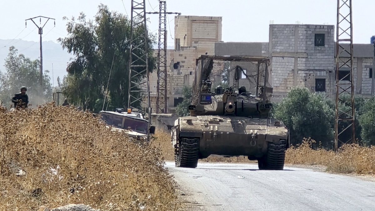 Israeli tanks patrol a village in rural Quneitra, Syria, Oct. 8, 2026. (AA Photo)