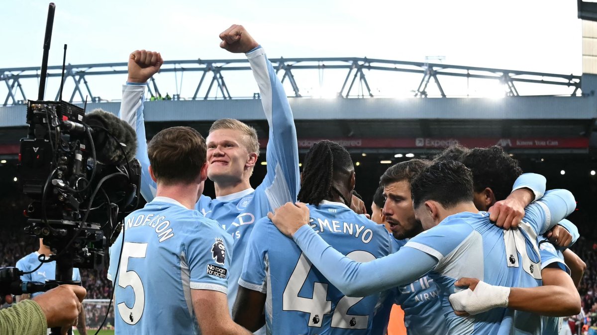 Manchester City's Erling Haaland celebrates with teammates after scoring the opening goal during the English Premier League football match between Liverpool and Manchester City at Anfield, Liverpool, U.K., Oct. 11, 2026. (AFP Photo)