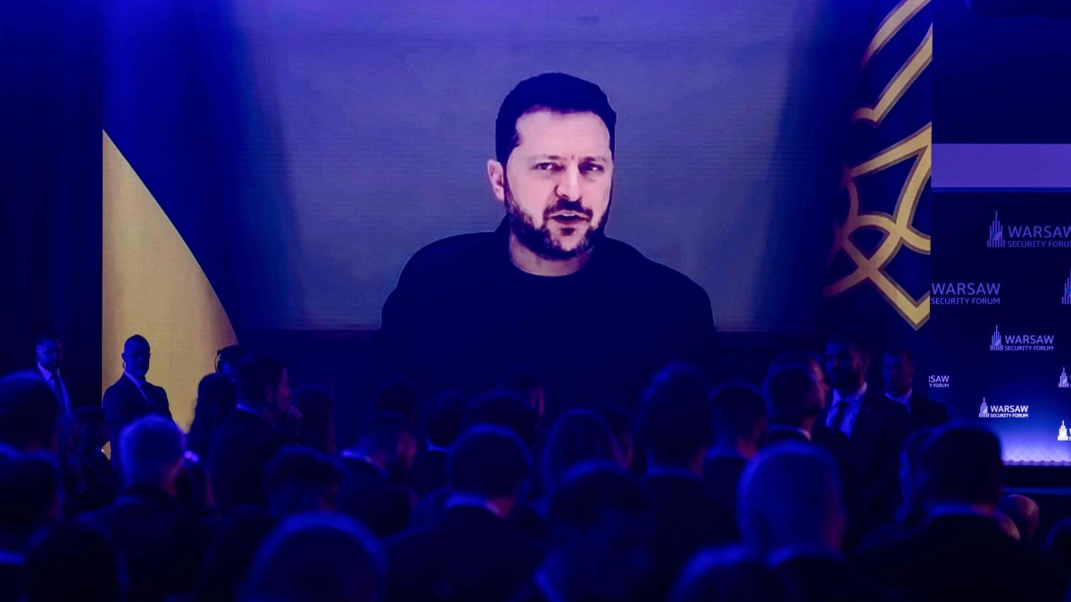 Participants listen as Ukraine's President Volodymyr Zelensky speaks via videolink during the opening session of the Warsaw Security Forum in Warsaw, Poland, Oct. 12, 2026. (AFP Photo)