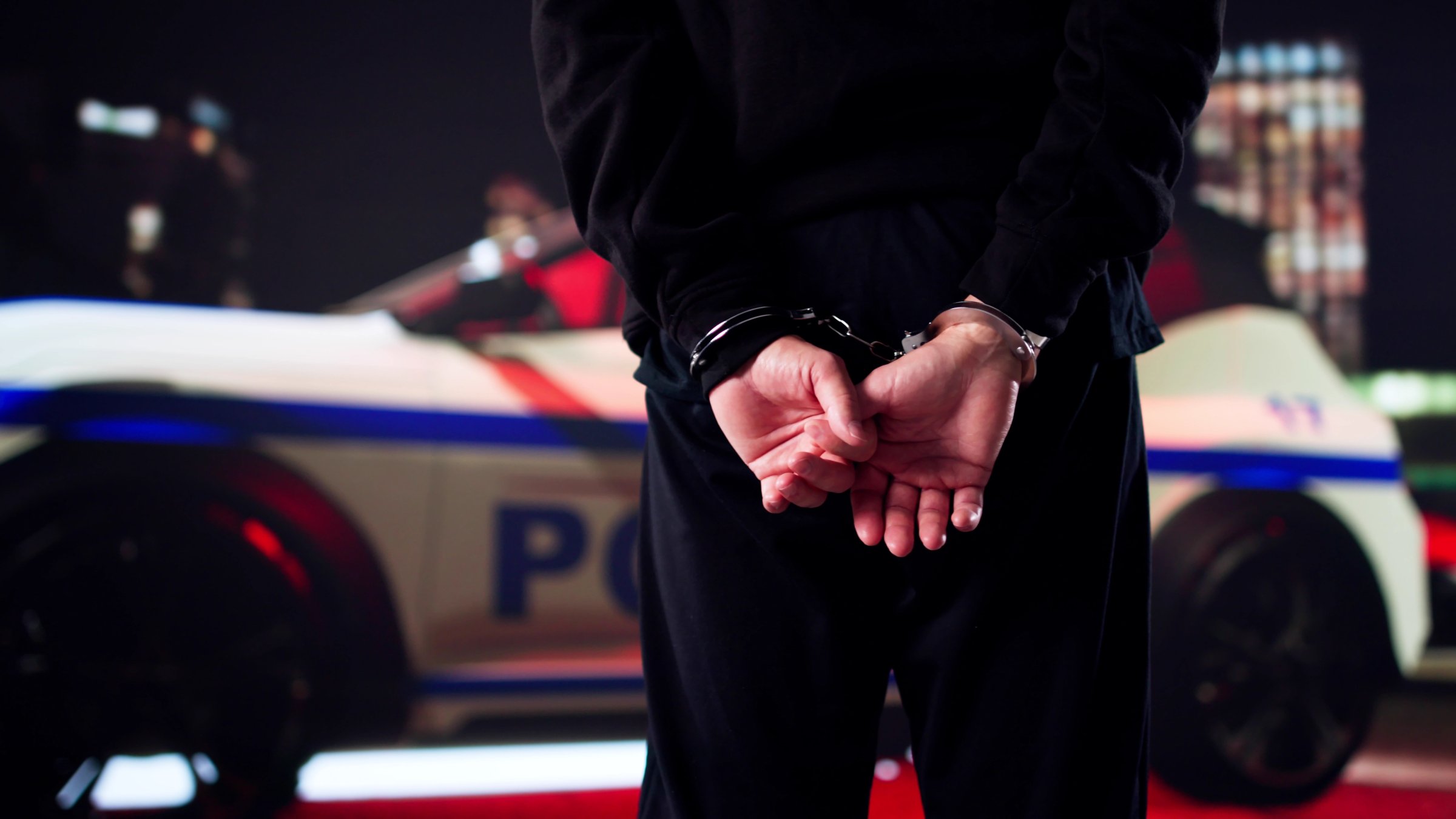 A suspect is arrested by police during an operation. (Shutterstcok Photo)
