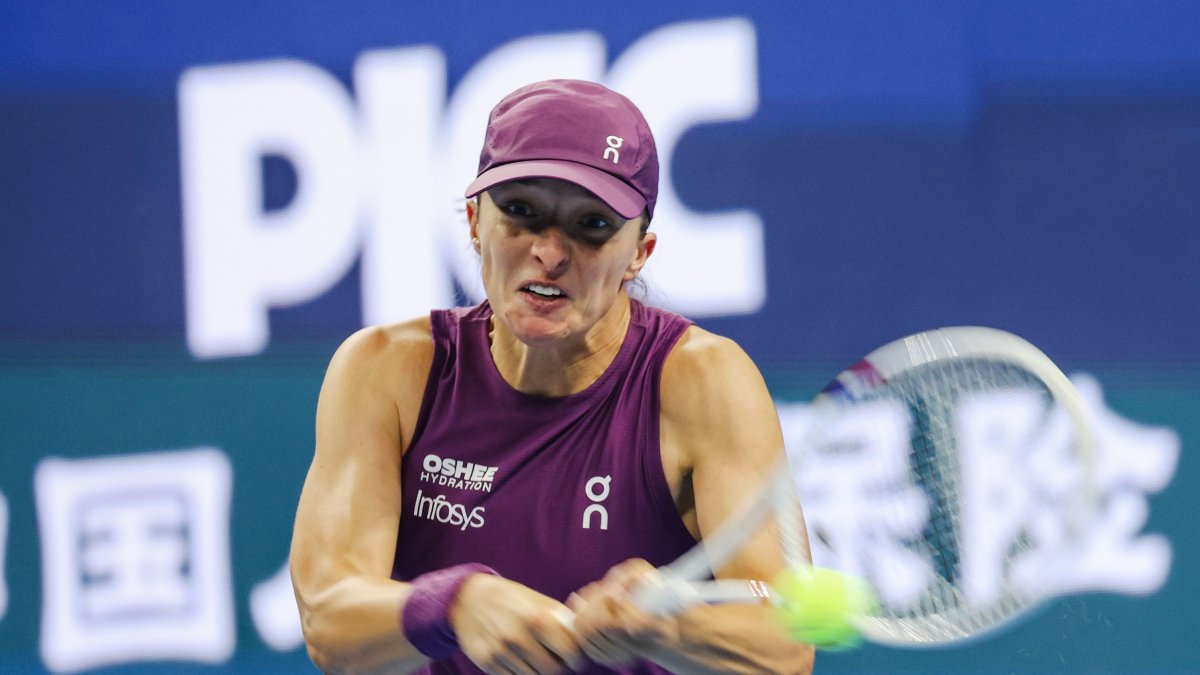 Poland's Iga Swiatek in action against Belgium's Elise Mertens during their Women’s Singles match at the China Open tennis tournament, Beijing, China, Oct. 9, 2026. (EPA Photo)
