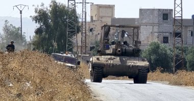 Israeli tanks patrol a village in rural Quneitra, Syria, Oct. 8, 2026. (AA Photo)