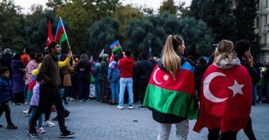 People with Azerbaijani and Turkish flags celebrate after the Second Karabakh War, which ended with Azerbaijan's victory, Baku, Azerbaijan, Nov. 10, 2020. (Shutterstock Photo)