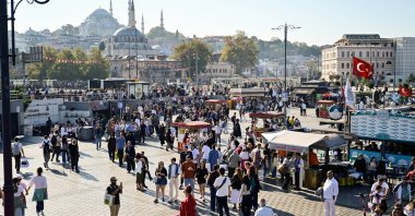 People tour the historic Eminönü neighborhood, Istanbul, Türkiye, Oct. 11, 2026. (AA Photo)