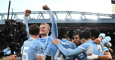 Manchester City's Erling Haaland celebrates with teammates after scoring the opening goal during the English Premier League football match between Liverpool and Manchester City at Anfield, Liverpool, U.K., Oct. 11, 2026. (AFP Photo)