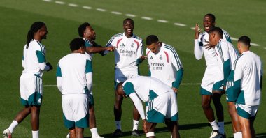 Real Madrid players joke during a training session at the Ciudad Real Madrid training ground in Madrid ahead of their UEFA Champions League football match against Roma, Rome, Italy, Oct. 13, 2026. (AFP Photo)