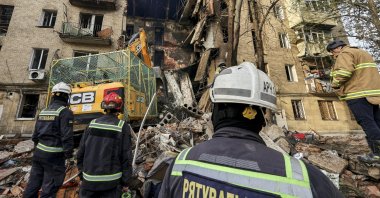 Ukrainian rescuers work at the site of a Russian strike on a residential building in Kharkiv, northeastern Ukraine, Oct. 13, 2026. (EPA Photo)