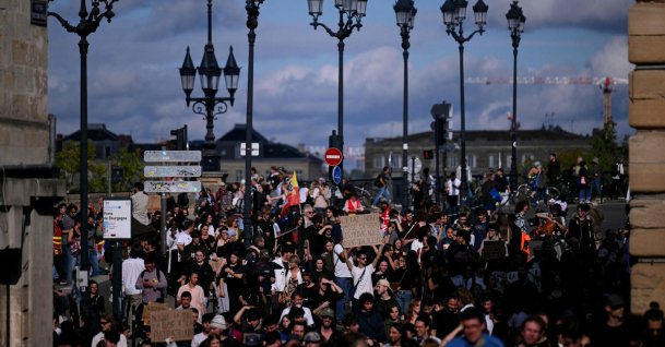 Protesters hold placards during a demonstration of high school students in Bordeaux, southwestern France, Oct. 13, 2026. (AFP Photo)