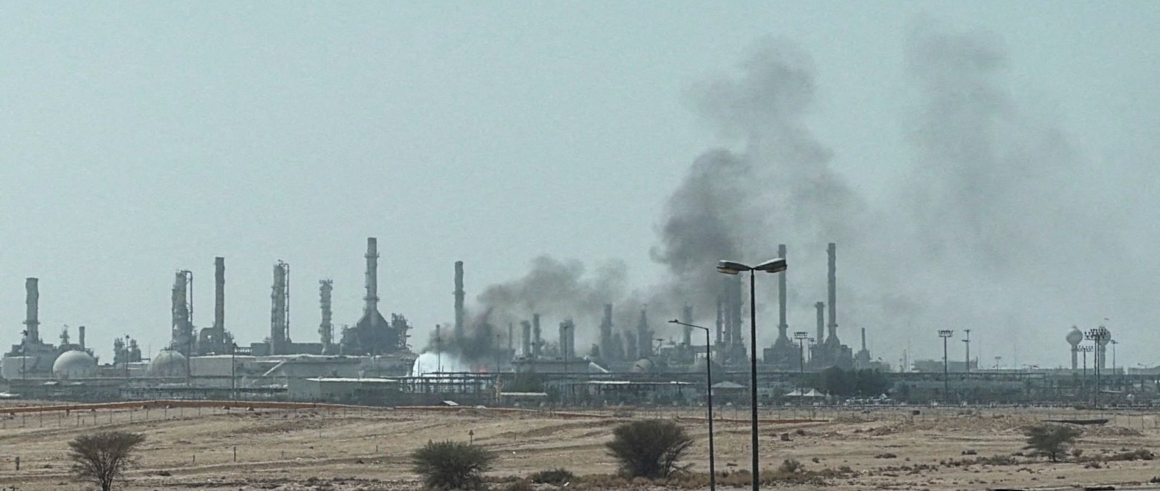 Smoke rises from a fire at the Aramco refinery south of Riyadh, Saudi Arabia, Oct.3, 2026. (Reuters File Photo)