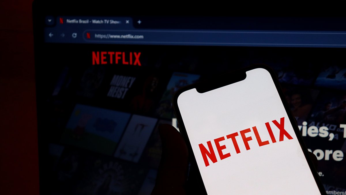 Netflix logo on a smartphone screen with the Netflix website displayed in the background, Salvador, Brazil, Jan. 26, 2026. (Shutterstock Photo)
