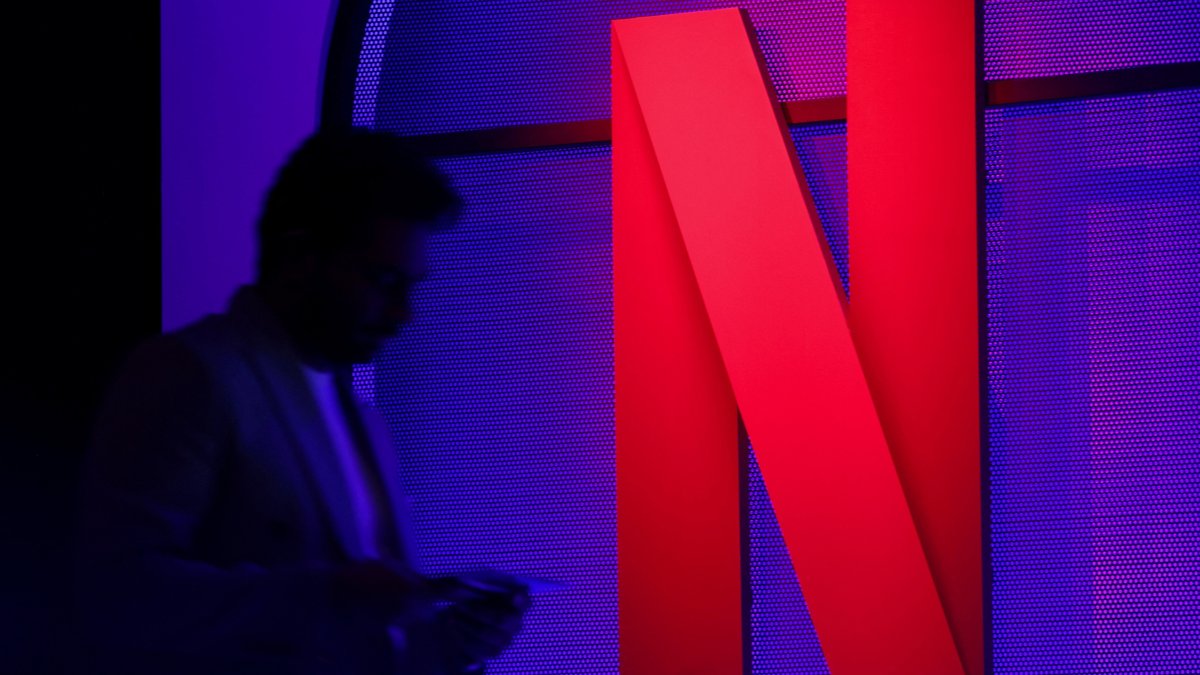 A man stands next to a Netflix logo during an event in Mumbai, India, Feb. 29, 2024. (Reuters Photo)