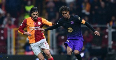 Barcelona's Lamine Yamal in action with Galatasaray's Eren Elmalı during the UEFA Champions League match at RAMS Park, Istanbul, Türkiye, Oct. 14, 2026. (AA Photo)