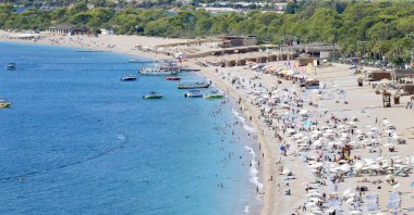 Tourists flock to beaches as hot weather draws crowds to the coast, Fethiye, Türkiye, Sept. 26, 2026. (AA Photo)