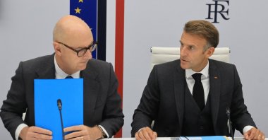 French President Emmanuel Macron reacts next to France's Economy, Finance and Industry Minister Roland Lescure following a video conference with G-7 leaders, at the Elysee Presidential Palace in Paris, France, Oct. 2, 2026. (Reuters Photo)