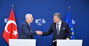 Trade Minister Ömer Bolat (L) shakes hands with European Commissioner for Trade Maros Sefcovic following their joint press conference, Brussels, Belgium, Oct. 13, 2026. (AA Photo)