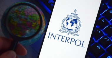 The smartphone with the Interpol logo displayed on the screen, Kharkiv, Ukraine, Sept. 15, 2025. (Shutterstock Photo)