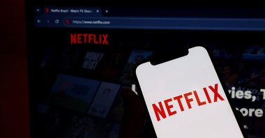 Netflix logo on a smartphone screen with the Netflix website displayed in the background, Salvador, Brazil, Jan. 26, 2026. (Shutterstock Photo)