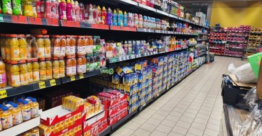 Supermarket aisle with bottled juices and boxed beverages in Hohenlimburg, Germany, June 12, 2026. (Shutterstock Photo)