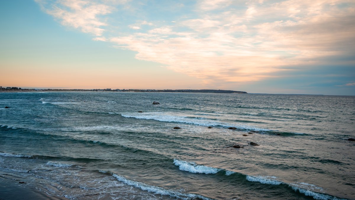 An undated view of waves along the Atlantic Ocean at sunset in Rhode Island, U.S.