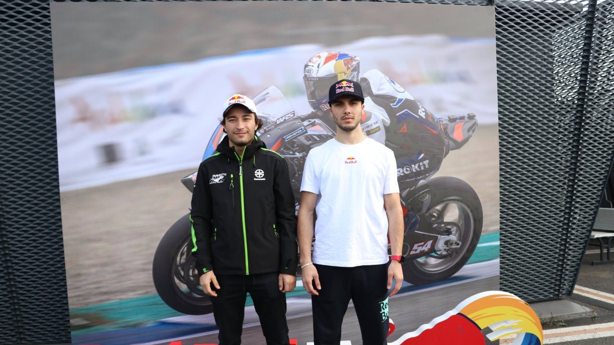 Turkish motorcyclists Can Öncü (L) and Bahattin Sofuoğlu pose for a photo, Istanbul, Türkiye, Feb. 15, 2024. (AA Photo)